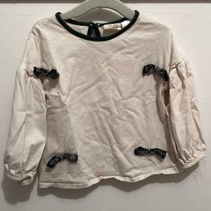 Zara baby 12-18M cream shirt with green and black bows. Slight stain pictured
